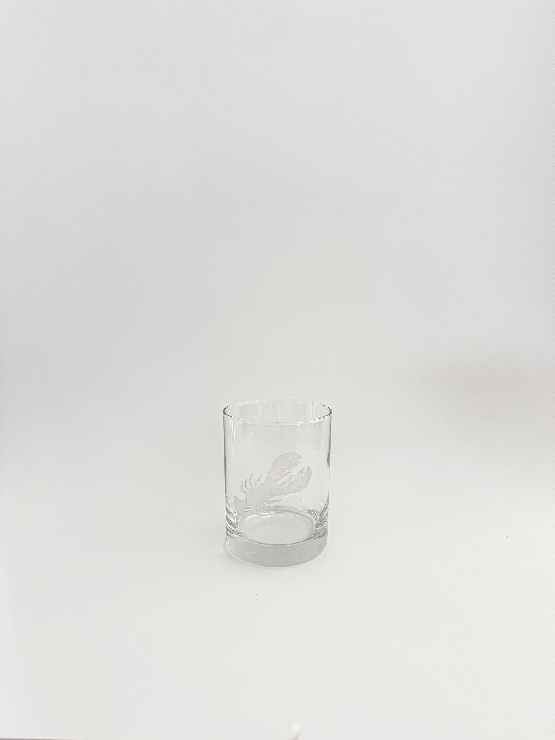 Clear glass tumbler on a white background