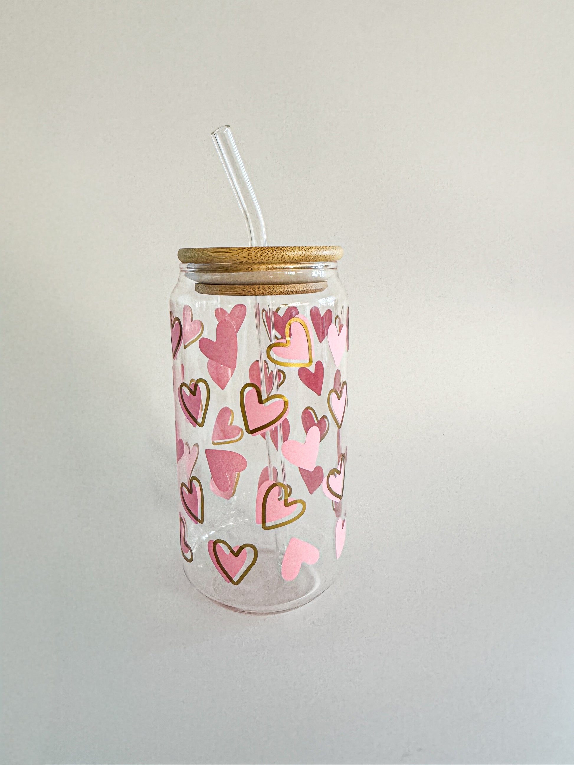 Pink and gold heart-patterned Valentine glass tumbler with bamboo lid and glass straw