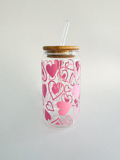 Clear Valentine glass tumbler with pink heart swirl pattern and glass straw