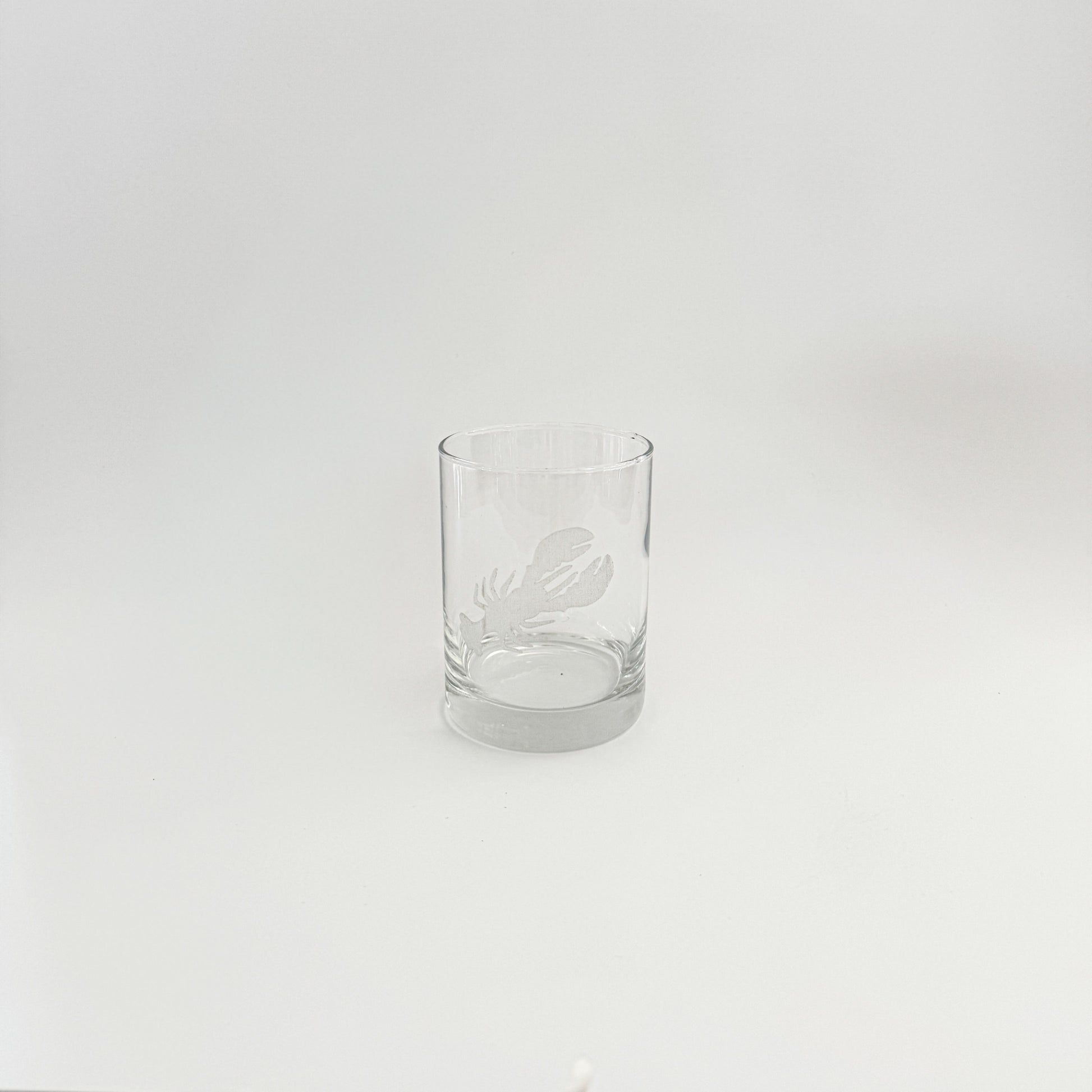 Clear glass tumbler on a white background